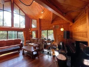 a living room with a couch and a tv at NAKADAKI ART VILLAGE - Vacation STAY 41950v in Shiigi