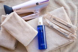 a toothbrush and a blow dryer sitting on a towel at Glamping & Villa La-gom - Vacation STAY 82912v in Inatori
