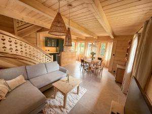 a living room with a couch and a table at Chochołóvka in Chochołów