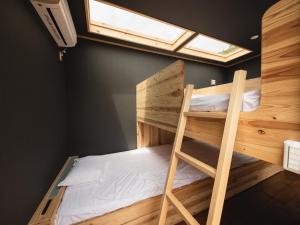 a bunk bed in a room with a ladder and a window at HOLE37 - Vacation STAY 42192v in Hōjō