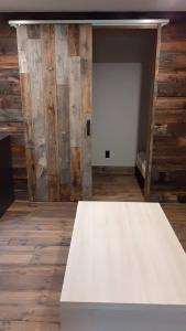 a white table in a room with wooden walls at Ayu no Sato Park Campsite - Vacation STAY 42240v in Shōbara