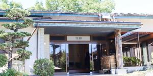 a building with a sign on the front of it at The Day Post General Glamping Village Yamanakako - Vacation STAY 02720v in Yamanakako