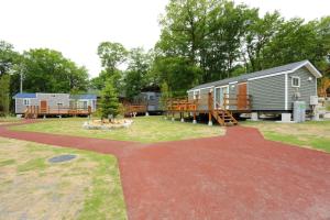 a group of rvs parked at a campground at OAK VILLAGE - Camp - Vacation STAY 42131v in Hakuba
