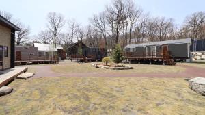 a park with a group of mobile homes at OAK VILLAGE - Camp - Vacation STAY 42131v in Hakuba +1 photo
