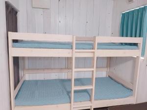 a set of bunk beds in a cabin at Asahi Seaside Cottage - Camp - Vacation STAY 42133v in Asahi +27 photos