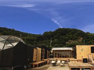 a patio with chairs and tables and a building at HOLE37 - Vacation STAY 42189v in Hōjō