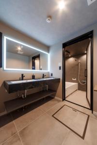 a bathroom with a large black sink and a shower at GranTerace Sun - Vacation STAY 15256 in Numazu