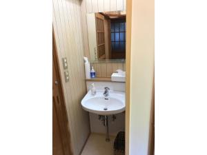 a bathroom with a sink and a mirror at Nanakuniyama Minka - Vacation STAY 37250v in Isumi +42 photos