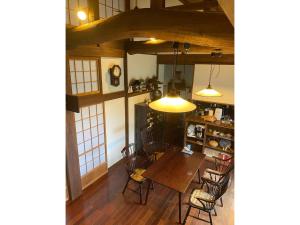 a dining room with a table and chairs at Nanakuniyama Minka - Vacation STAY 37250v in Isumi