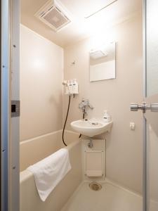a bathroom with a sink and a bath tub at maison elegance - Vacation STAY 15341 in Tokyo +26 photos