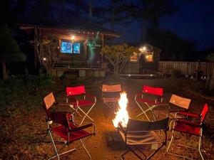 a group of chairs around a fire in a yard at night at YUDA BASE - Vacation STAY 42200v in Ninohe