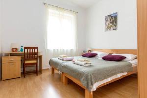 Posteľ alebo postele v izbe v ubytovaní Apartments Calendula Rubic