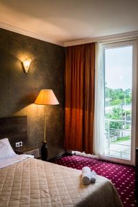 Voodi või voodid majutusasutuse Orange Hotel toas