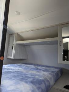 a bedroom with a bed in a small room at Ko-eda Village - Camp - Vacation STAY 42159v in Iioka