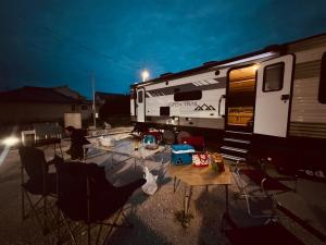 an rv is parked next to a table and chairs at Ko-eda Village - Camp - Vacation STAY 42159v in Iioka