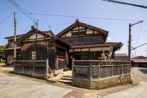 an old wooden house with a fence in front of it at MAGONI - Vacation STAY 66651v in Kaga