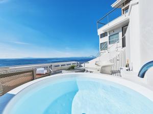 a swimming pool on the balcony of a house at &SUN Terrace house - Vacation STAY 67119v in Yokosuka
