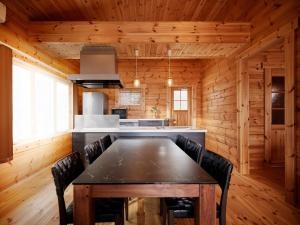 a dining room with a table and a kitchen at &SUN Hung five - Vacation STAY 67613v in Minamiboso
