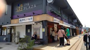 a group of people standing outside of a store at Yagisawa Home - Vacation STAY 67831v in Nikko