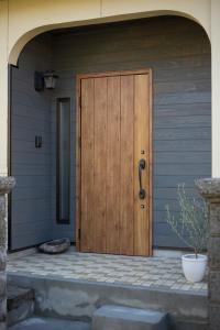a wooden door on the side of a house at HanareSou - Vacation STAY 15441 in Kirishima