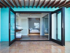 a room with a bathroom with a sink and a bedroom at &MOON Noa - Vacation STAY 72009v in Hayama