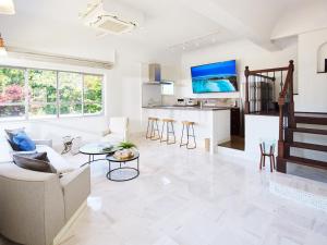 a living room with a couch and a table at SAJIMA Funny house - Vacation STAY 15436 in Hayama