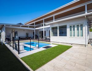 a house with a swimming pool in a yard at MIYAZAKI BASE in aoshima - Vacation STAY 82721v in Miyazaki