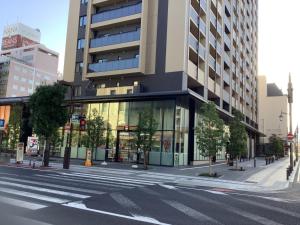 an empty city street with a large building at GUEST HOUSE BLUE DOORS - Vacation STAY 73130v in Yamagata