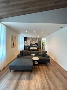 a living room with a couch and a table at Shinchiku design house - Vacation STAY 15468 in Ranzan