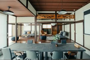 a living room with a large table and chairs at Sea saw - Vacation STAY 91738v in Isumi