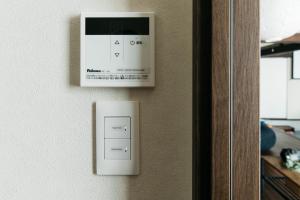 a lightswitch on a wall next to a door at Sea saw - Vacation STAY 91738v in Isumi