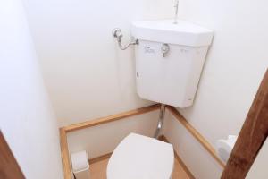 a bathroom with a toilet and a sink at green park heights - Vacation STAY 15685 in Musashino