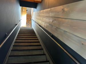 a staircase leading up to a building with wooden walls at Minato no minato 1391-8 - Vacation STAY 92224v in Minamiawaji