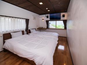 Giường trong phòng chung tại Oyado Denkichi - Vacation STAY 91691v