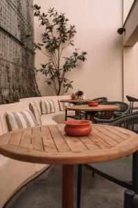 a wooden table with bowls on top of it at SKIPR Hotel in Antwerp