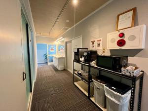 a room with a kitchen with a counter with microwaves at Yuzawa House - Vacation STAY 07072v in Yuzawa