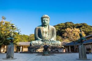a large statue of a buddha in a courtyard at THE CABIN KAMAKURA - Vacation STAY 20235v in Kamakura