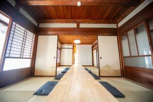 a row of yoga mats in a room with windows at Kominka Besso - Vacation STAY 15819 in Kuwana