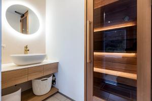 a bathroom with a sink and a mirror at R;MOGAMI - Vacation STAY 25467v in Kiyokawa