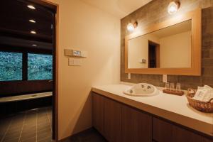 a bathroom with a sink and a mirror at Mizuho Highland - Camp - Vacation STAY 42325v in Utsunobara +11 photos