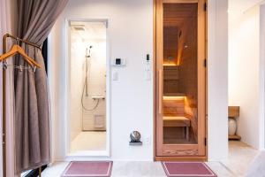 a bathroom with a shower and a glass door at R;MOGAMI - Vacation STAY 25480v in Kiyokawa