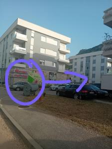 a purple sign in front of a parking lot at Aura Trebinje 2 in Trebinje