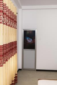 Μια τηλεόραση ή/και κέντρο ψυχαγωγίας στο Villa South view Residence