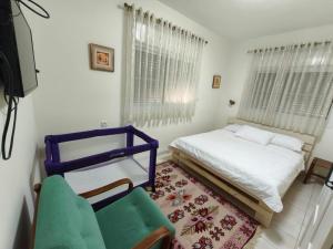 Postel nebo postele na pokoji v ubytování Noam Hamargalit + 26 fotografií