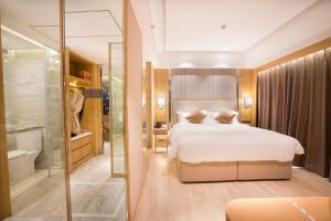 Postel nebo postele na pokoji v ubytování 郑州豪锦汇酒店 Zhengzhou Haojinhui Hotel