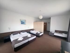 Ένα ή περισσότερα κρεβάτια σε δωμάτιο στο Rooms Laguna +25 φωτογραφίες