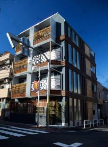 a tall building on a city street with a traffic light at Numero Uno Tokyo - Vacation STAY 25720v in Tokyo