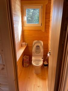a small bathroom with a toilet with the lid up at Biwako Hills - Vacation STAY 27827v in Takashima