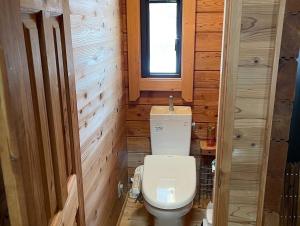 a small bathroom with a toilet and a window at Biwako Hills - Vacation STAY 27815v in Takashima