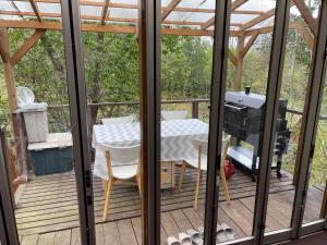 a screened in deck with a table and a grill at Biwako Hills - Vacation STAY 27815v in Takashima +15 photos